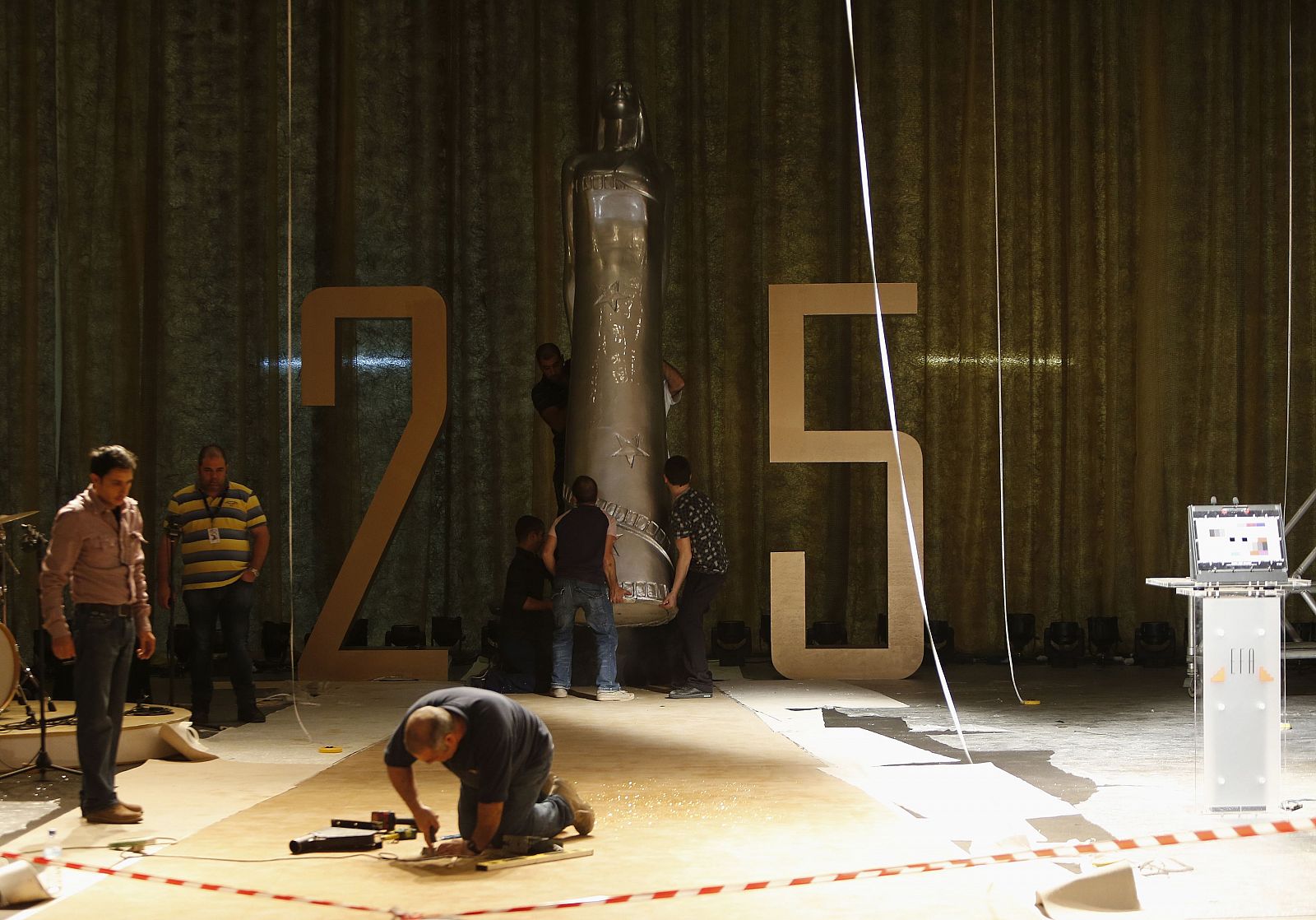 Workers prepare the stage for the 25th European Film Awards at the Mediterranean Conference Centre in Valletta