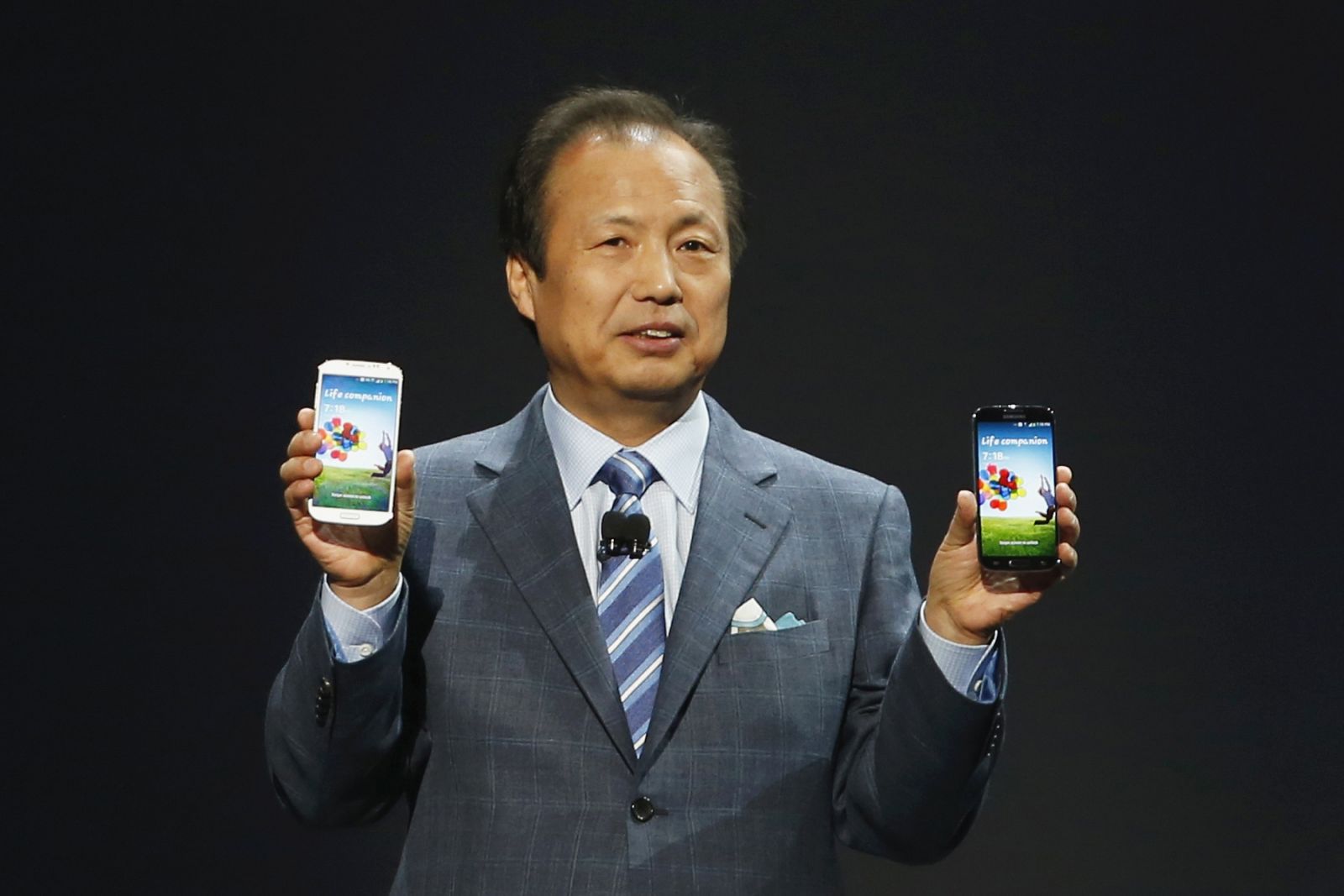 Shin, President and Head of IT and Mobile Communication Division, holds Galaxy S4 phone during its launch at the Radio City Music Hall in New York