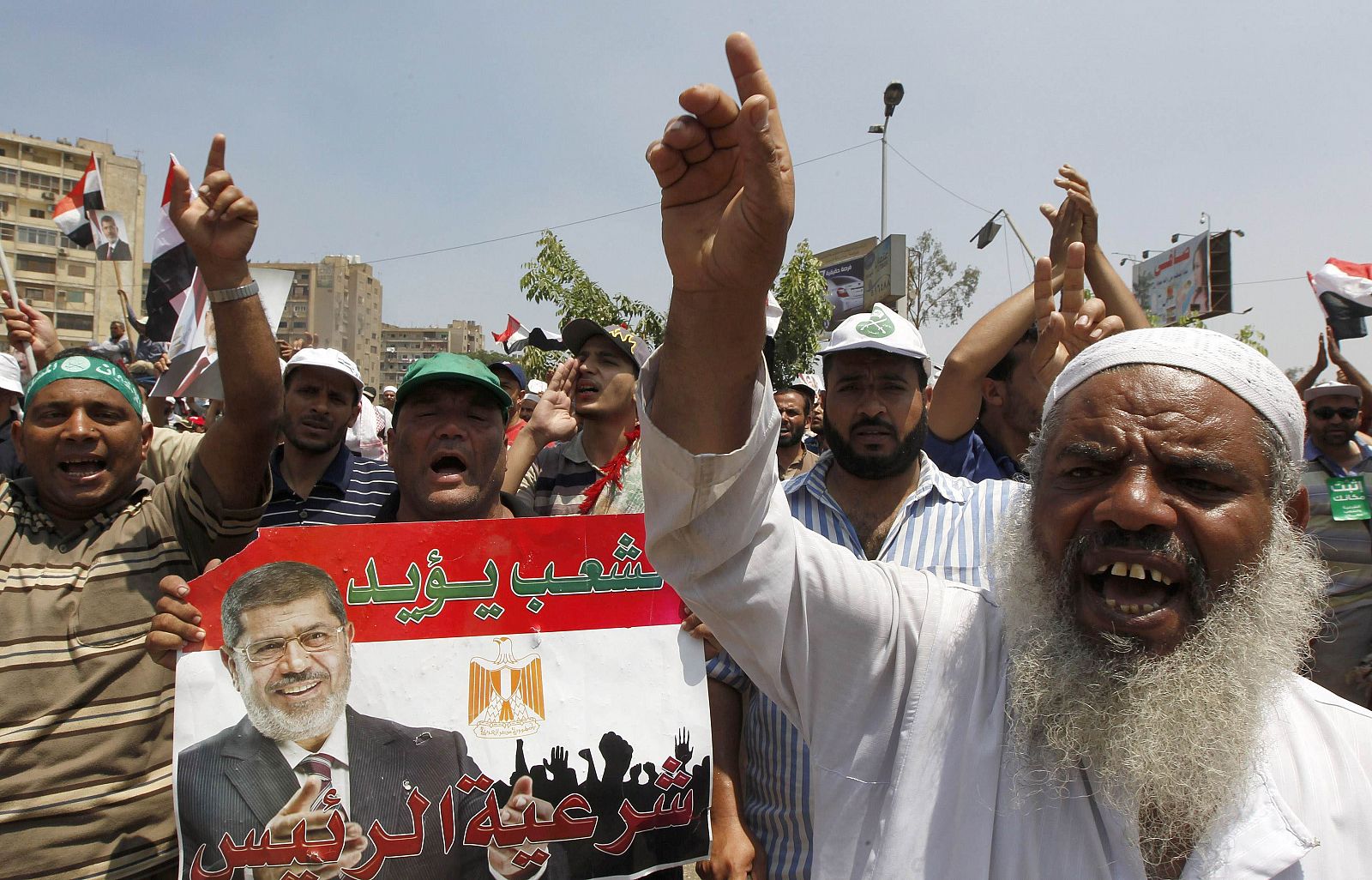 Members of the Muslim Brotherhood and supporters of ousted Egyptian President Mohamed Mursi shout slogans in Cairo