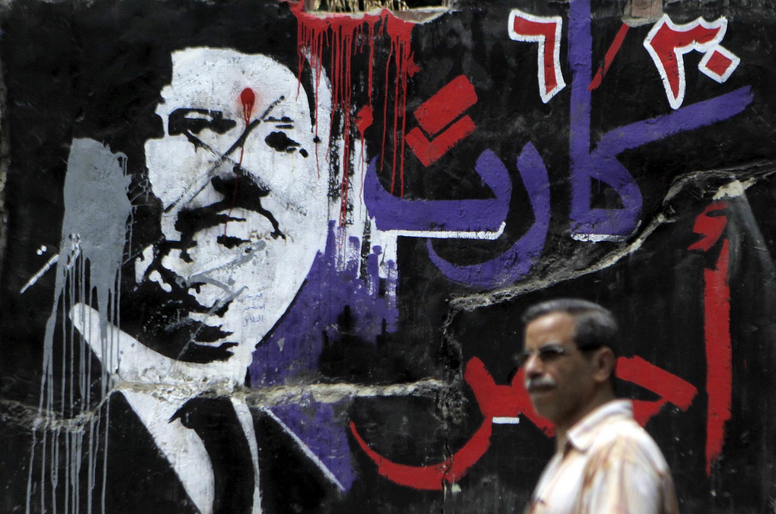 Grafiti con la imagen de Mohamed Morsi en El Cairo