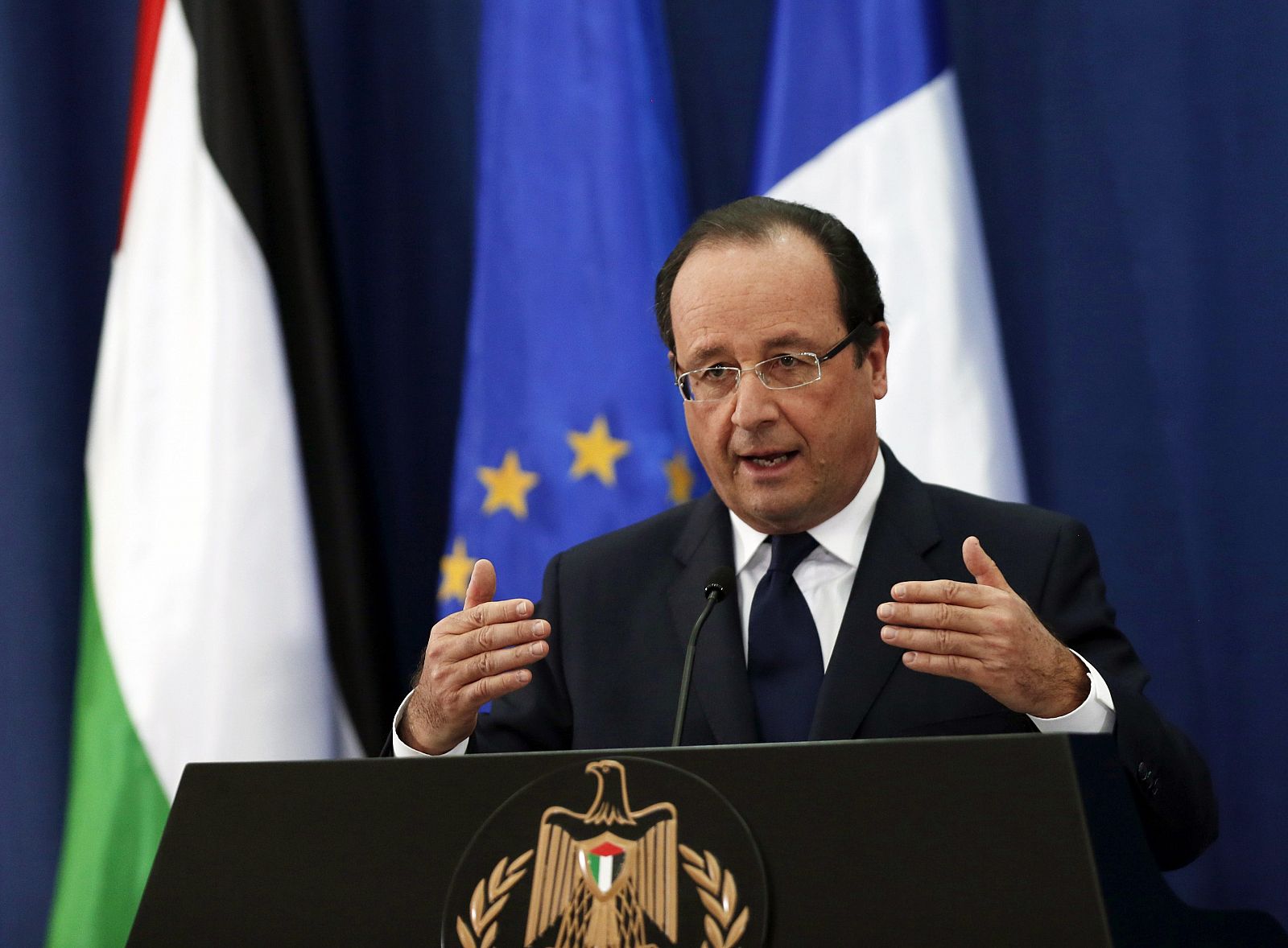 French President Hollande speaks during a joint news conference with his Palestinian counterpart Abbas in Ramallah