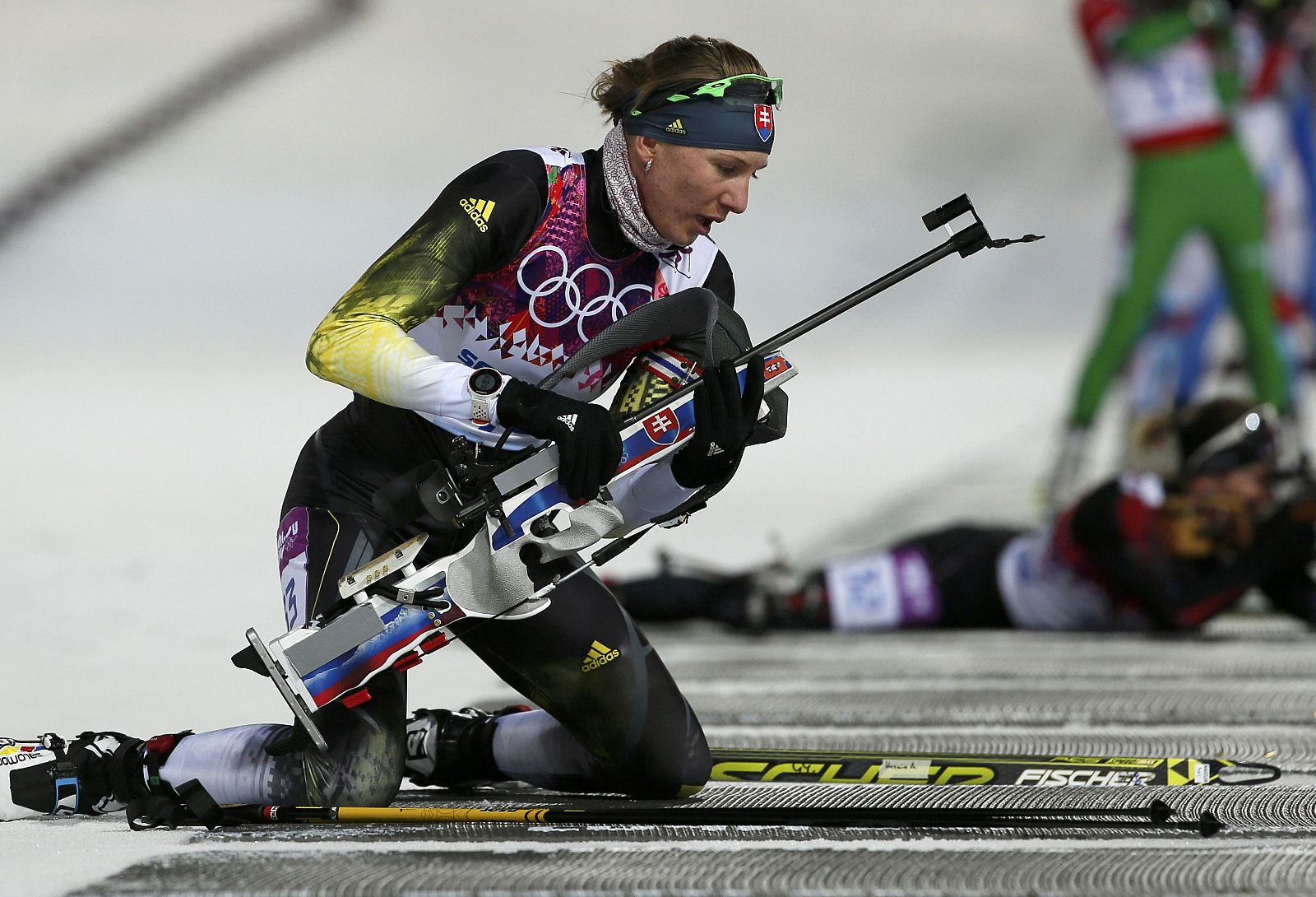 Slovakia's Kuzmina prepares to shoot during women's biathlon 7.5km sprint event  at 2014 Sochi Winter Olympics