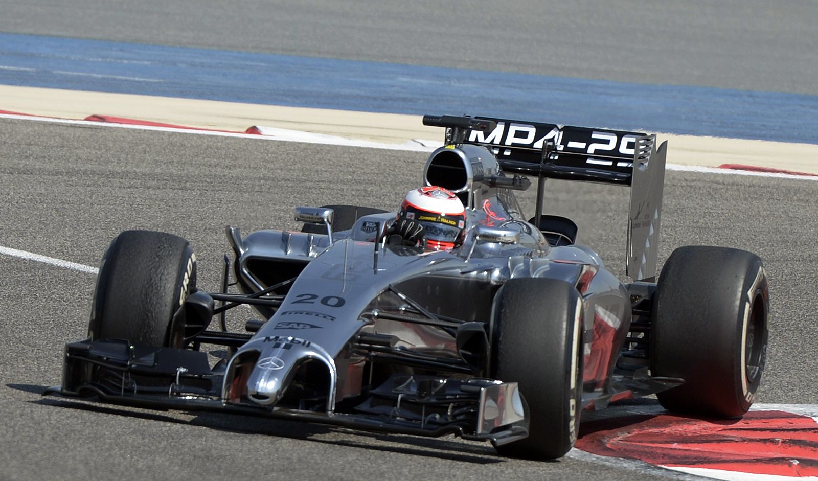 McLaren F1 driver Kevin Magnussen of Denmark drives during the first day of Formula One testing in Bahrain International Circuit in Sakhir