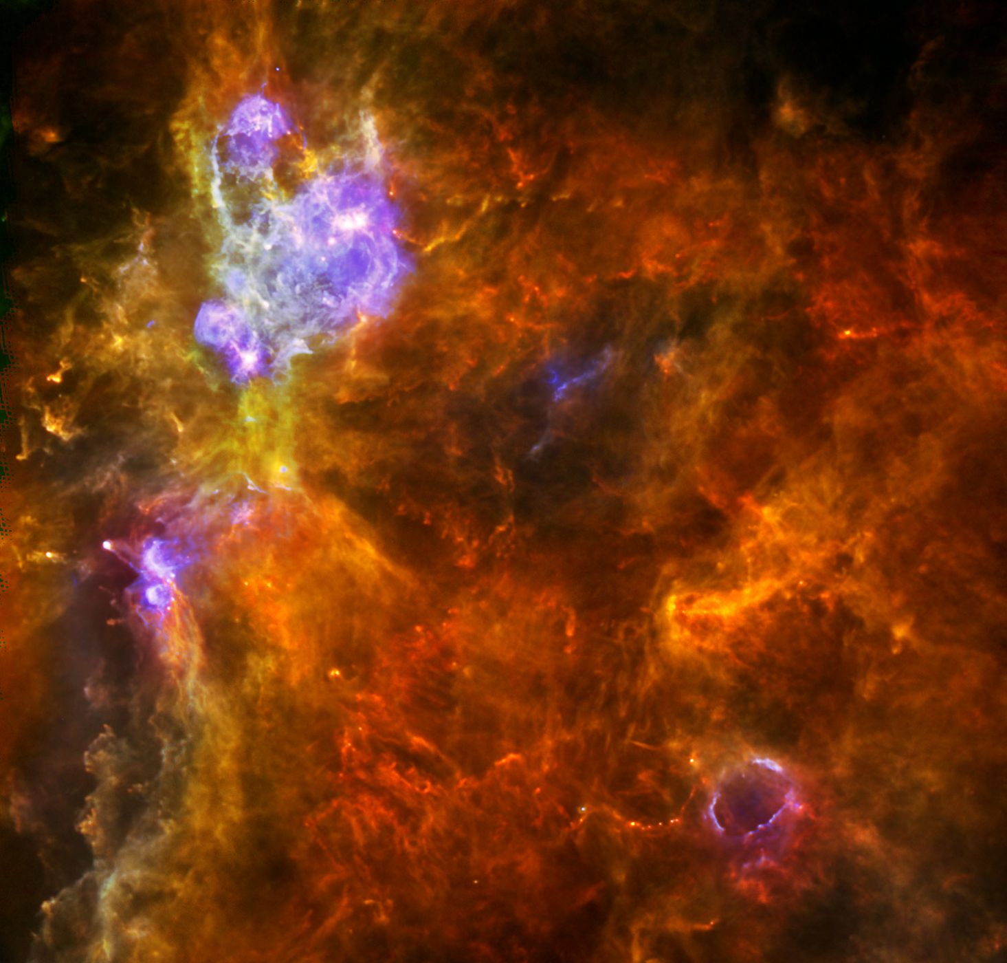 La nube molecular gigante W3 captada por el telescopio espacial Herschel.