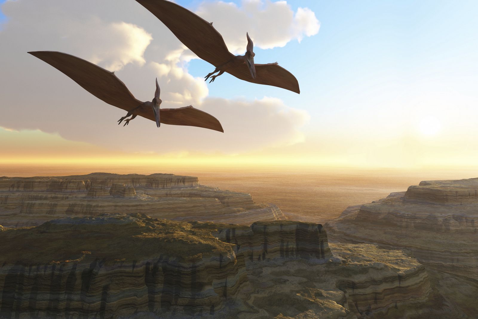 Ilustración de pterosaurios sobrevolando un cañón prehistórico.