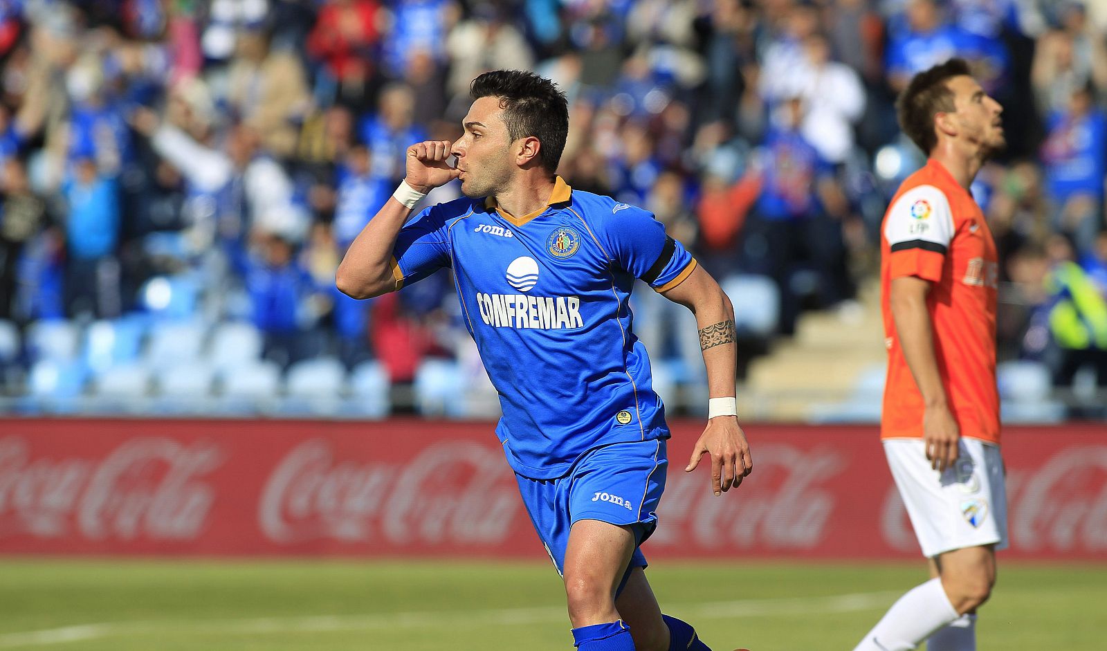 El jugador del Getafe Adrían Colunga celebra el gol ante el Málaga.