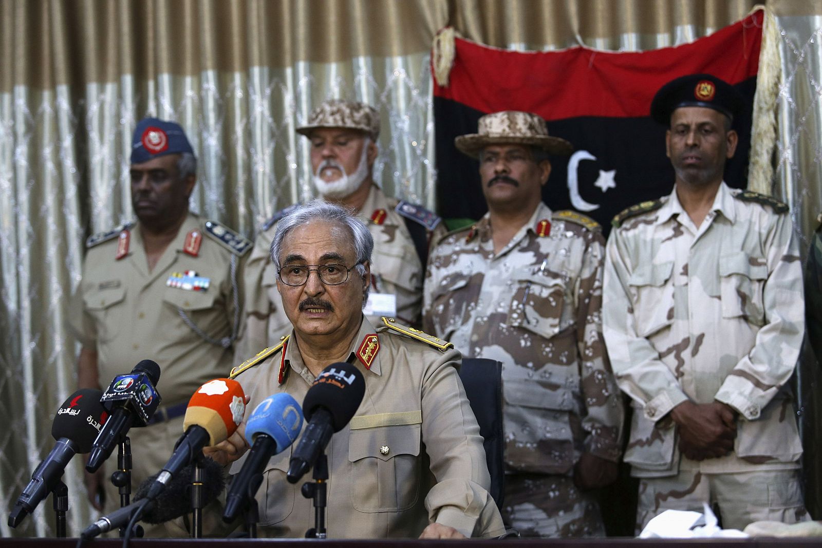 General Khalifa Haftar speaks during news conference at sports club in Abyar