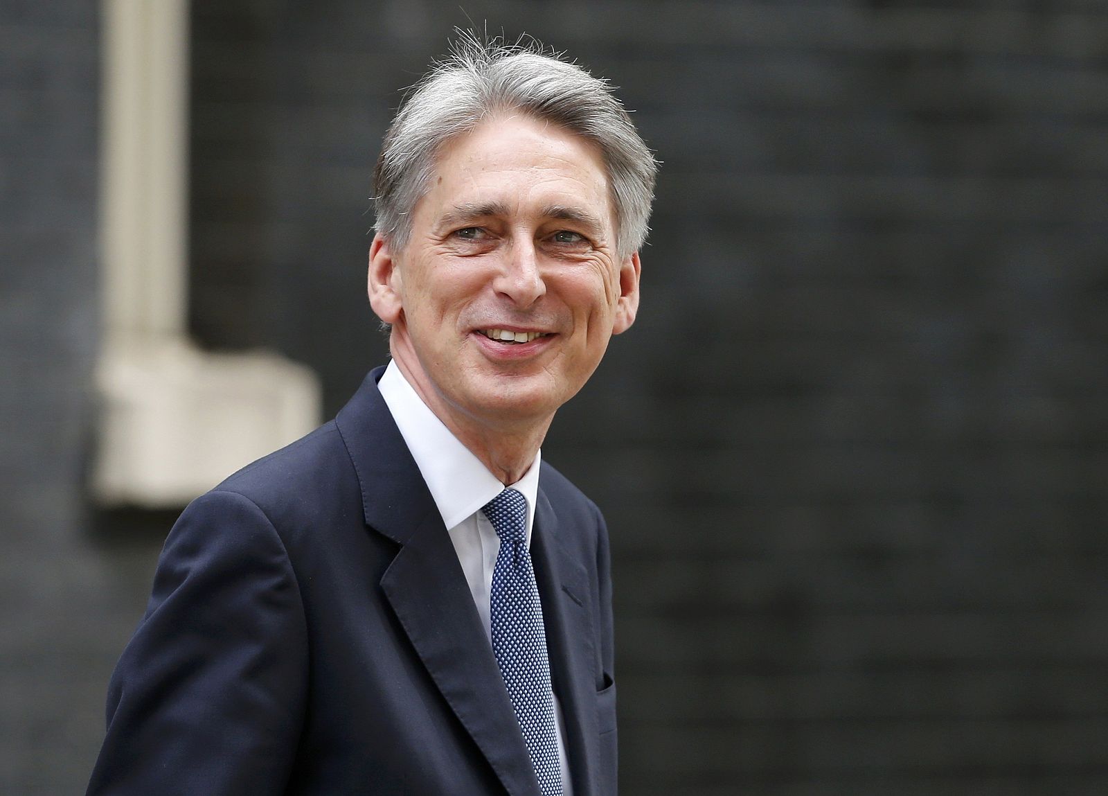 Britain's new Foreign Secretary Philip Hammond arrives at 10 Downing Street in central London