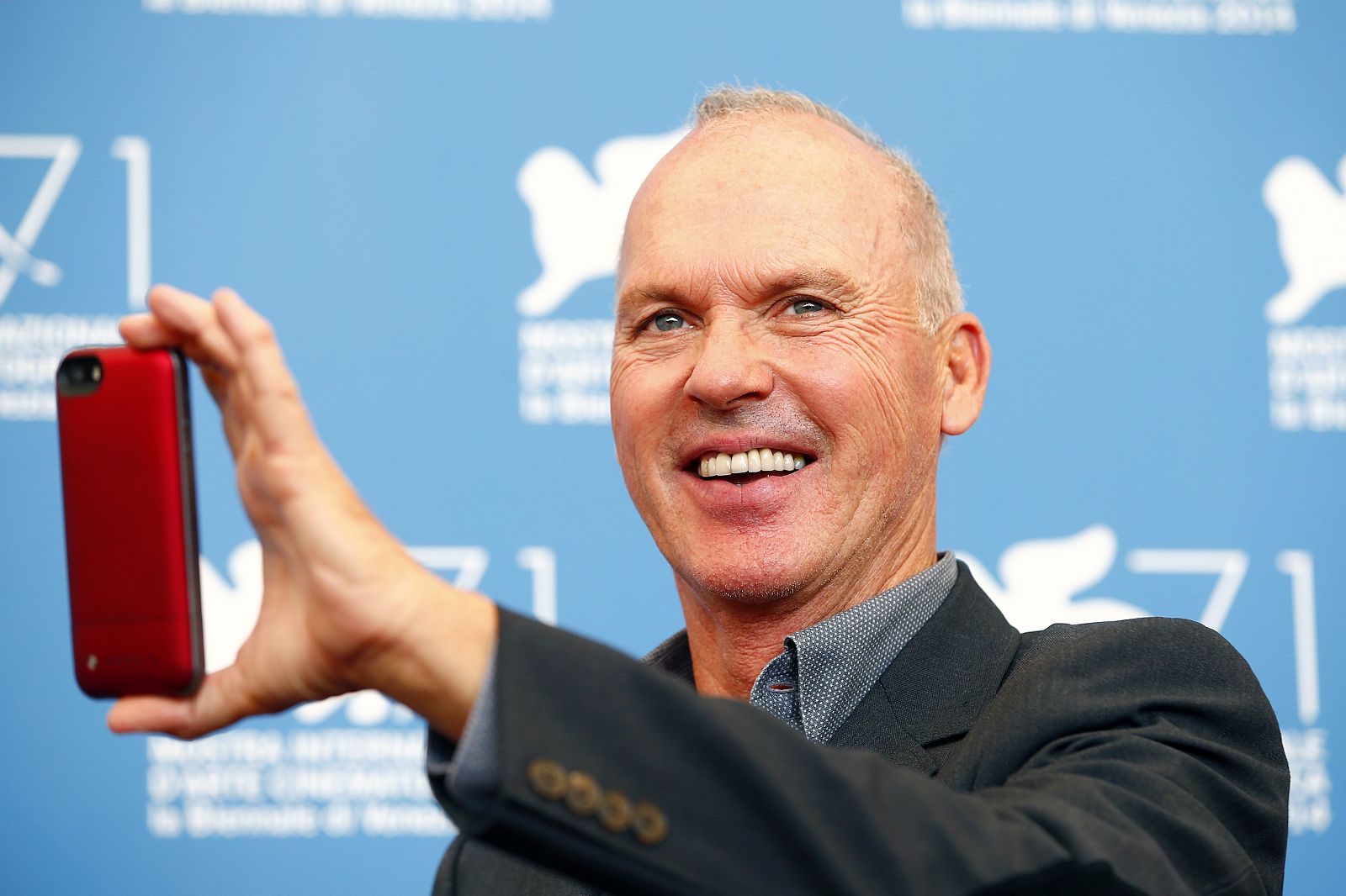 U.S. actor Michael Keaton poses during the photo call for the movie "Birdman or (The unexpected virtue of ignorance)" at the 71st Venice Film Festival