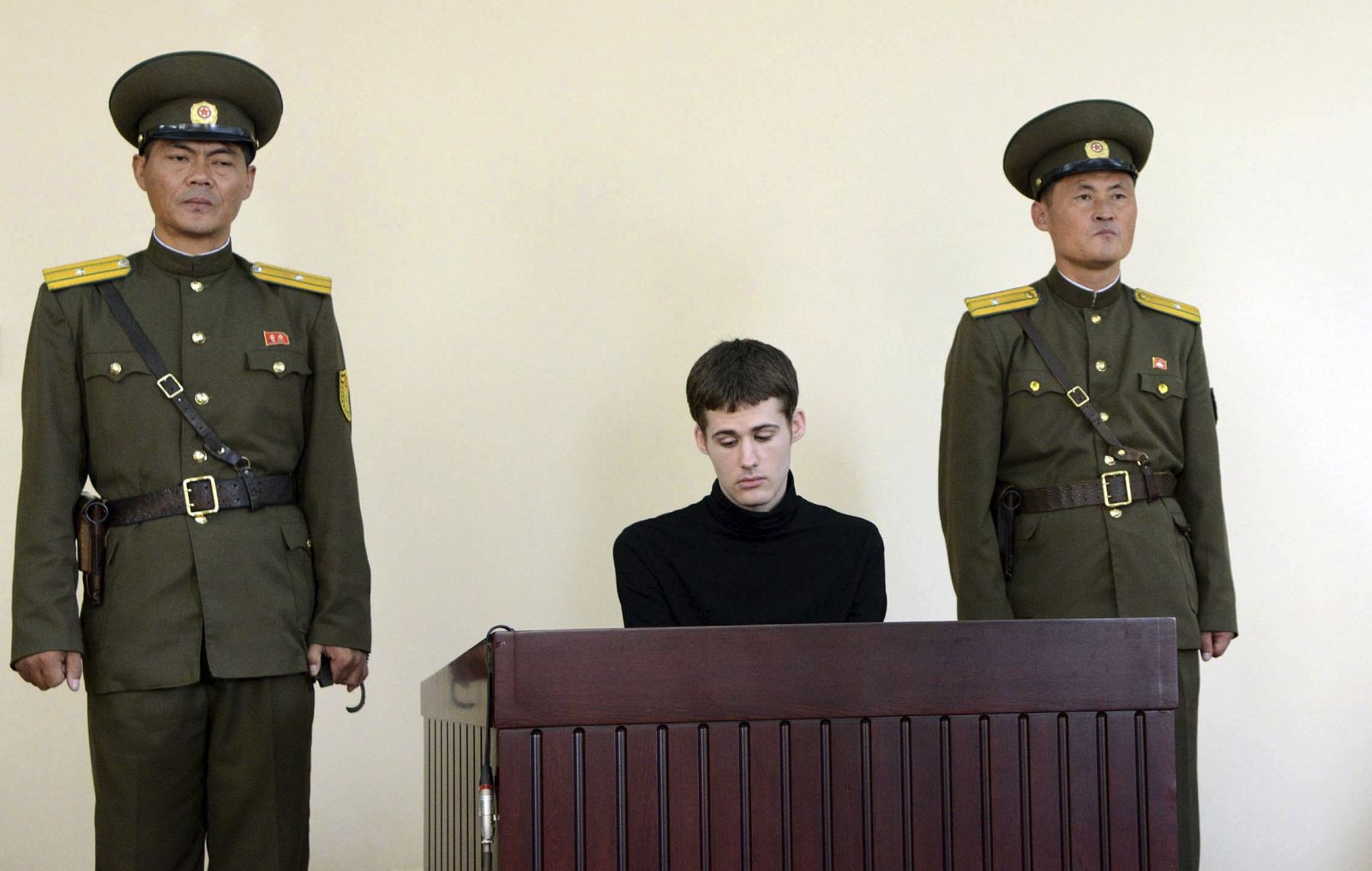 U.S. citizen Matthew Todd Miller sits in a witness box during his trial at the North Korean Supreme Court