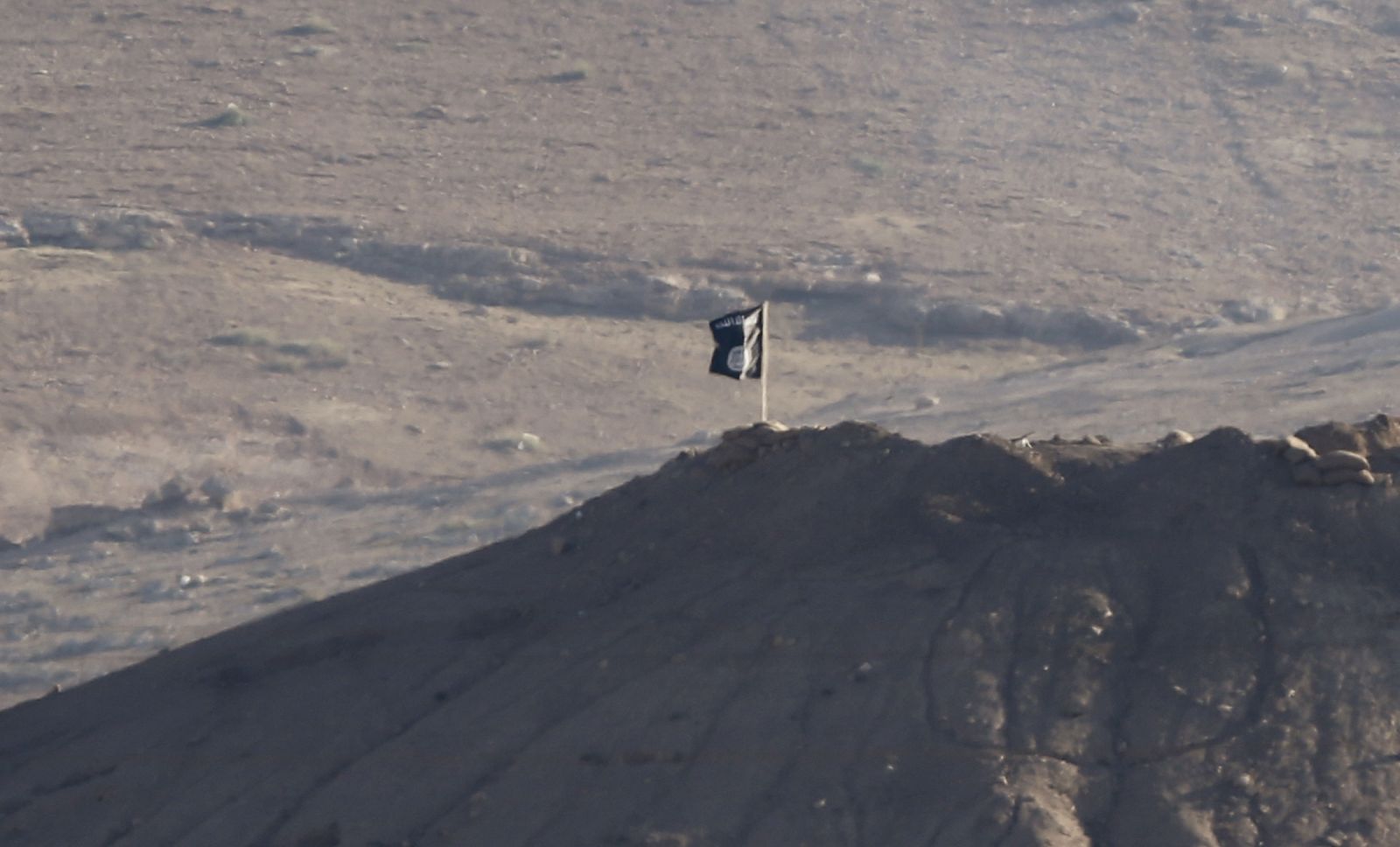 Black flag belonging to the Islamic State is seen near the Syrian town of Kobani, as pictured from the Turkish-Syrian border near the southeastern town of Suruc in Sanliurfa province