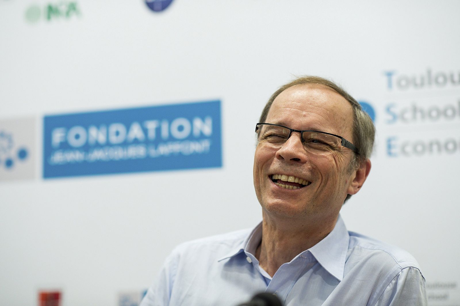 French economist Jean Tirole speaks during a news conference at the Toulouse School of Economics in Toulouse