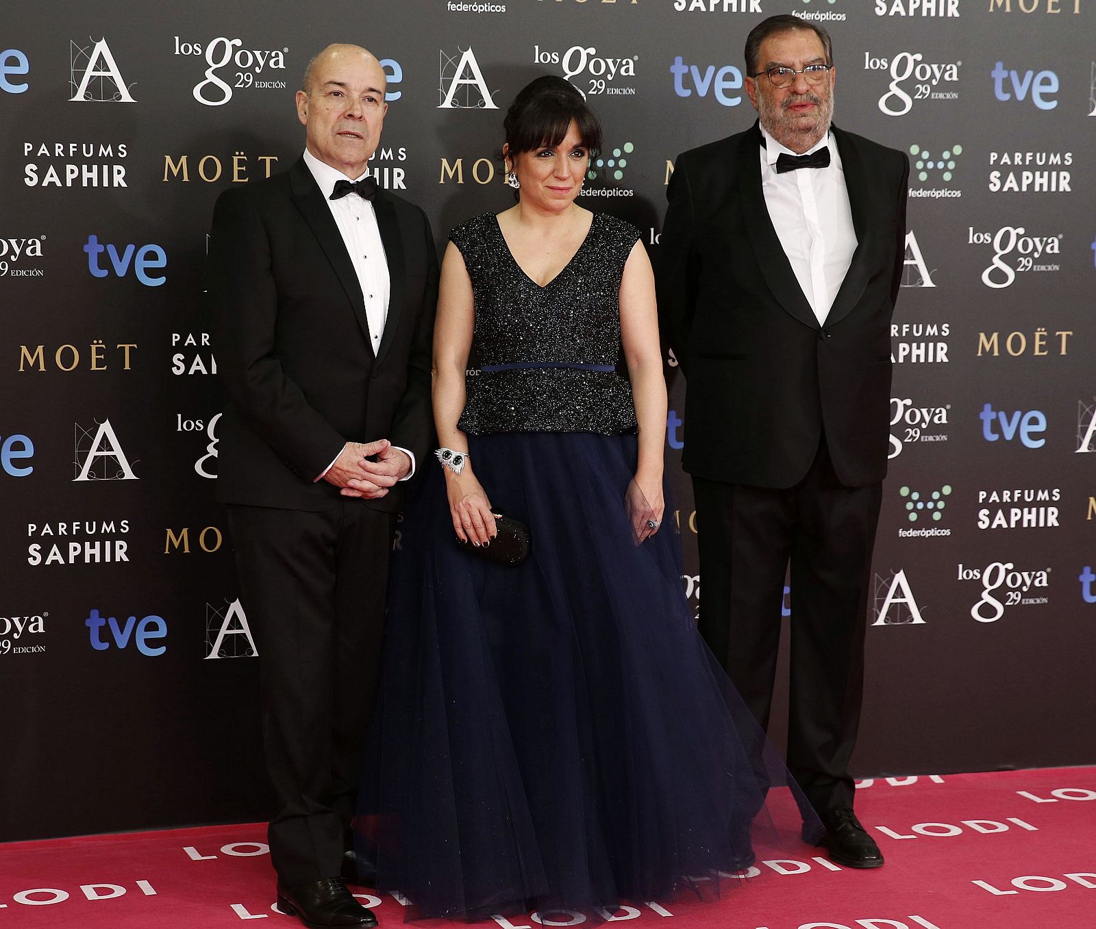 Spanish Film Academy vice presidents actor Antonio Resines (L) and Judith Colell pose along with the academy's president Enrique Gonzalez Macho (R) on the