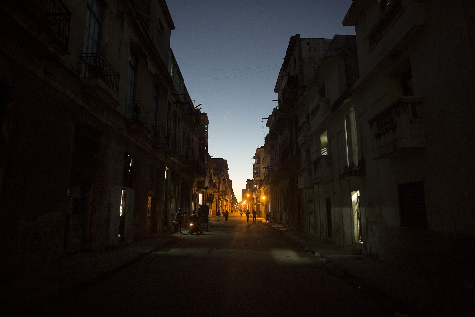People walk on the street in downtown Havana