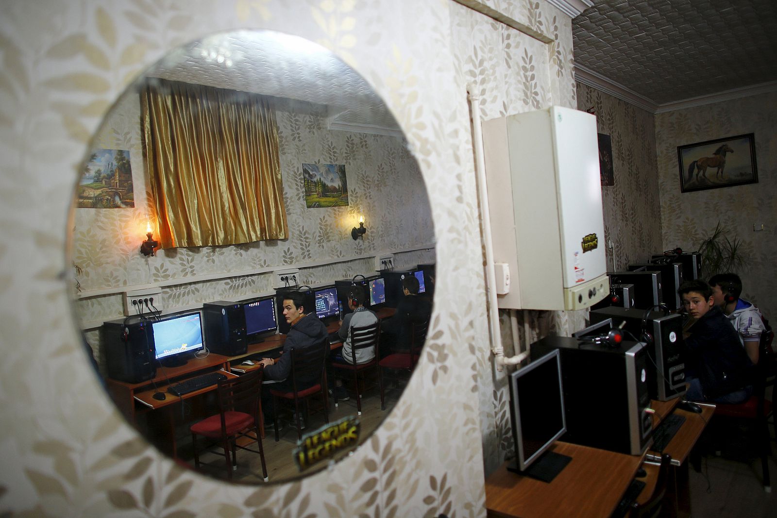 People use computers at an internet cafe in Ankara