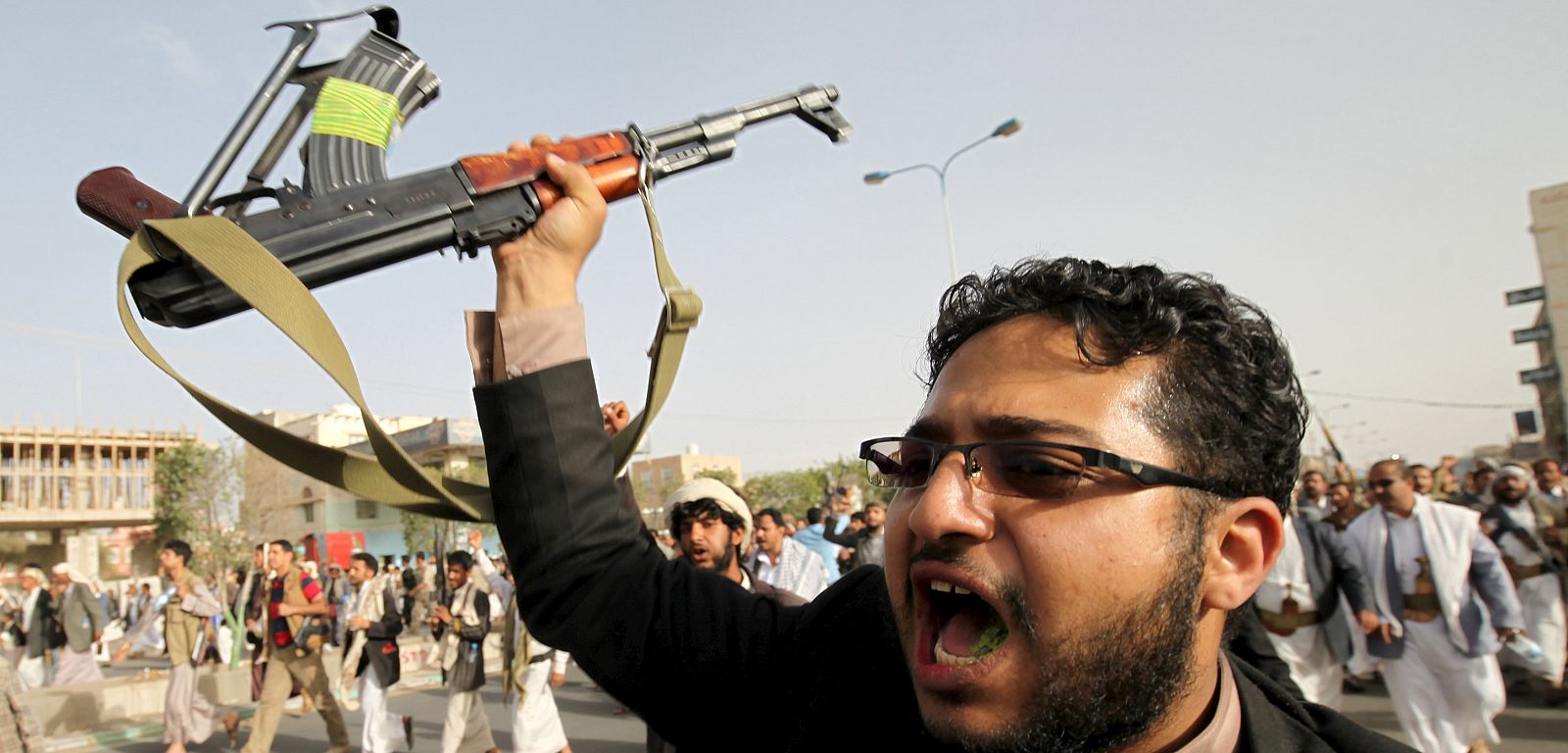 Follower of the Houthi movement shouts slogans during a protest against the Saudi-led air strikes in Sanaa