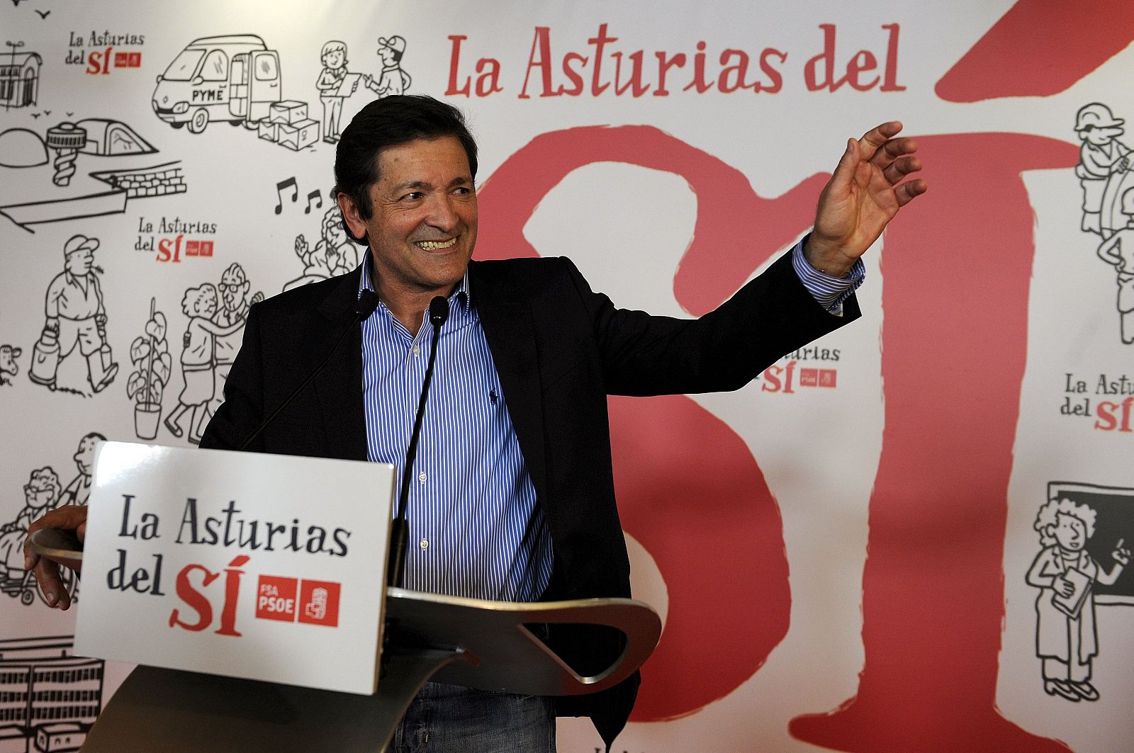 Javier Fernandez, president of the regional Government of Asturias and candidate of Spain's Socialist Party (PSOE), smiles during a news conference where he announced his electoral victory, in Oviedo