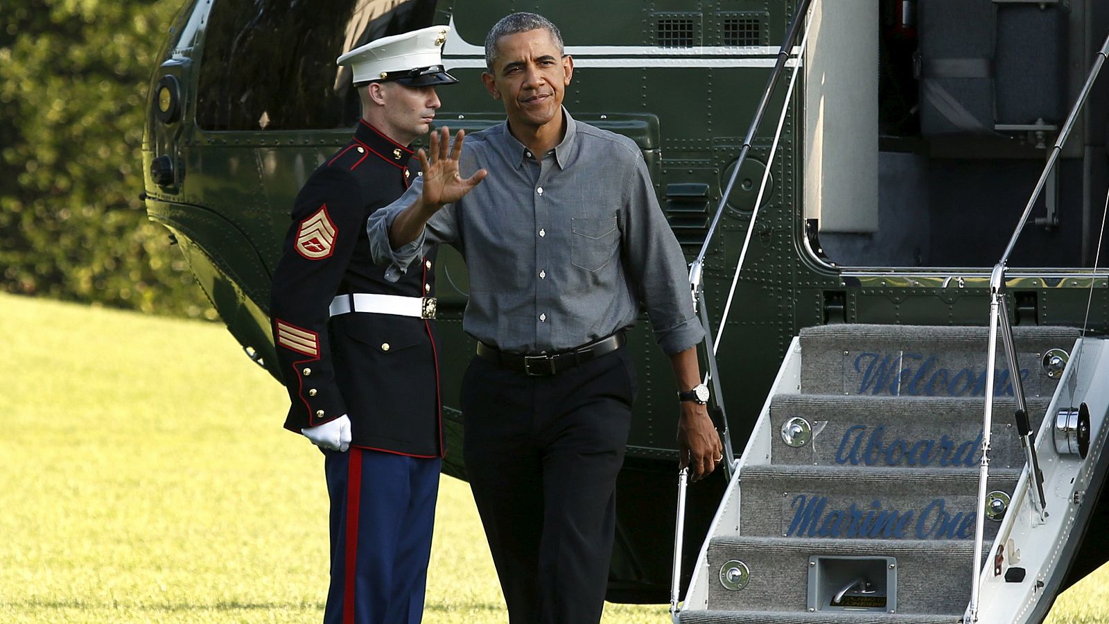 President Barack Obama waves as he walks on the South Lawn of the White House