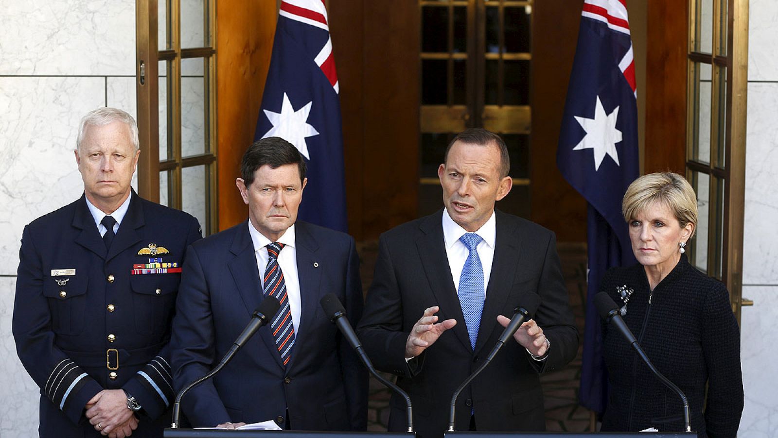 Australian Prime Minister Tony Abbott announces Australia's acceptance of Syrian refugees alongside Binskin, Defence Minister Kevin Andrews and Foreign Minister Julie Bishop at Parliament House in Canberra