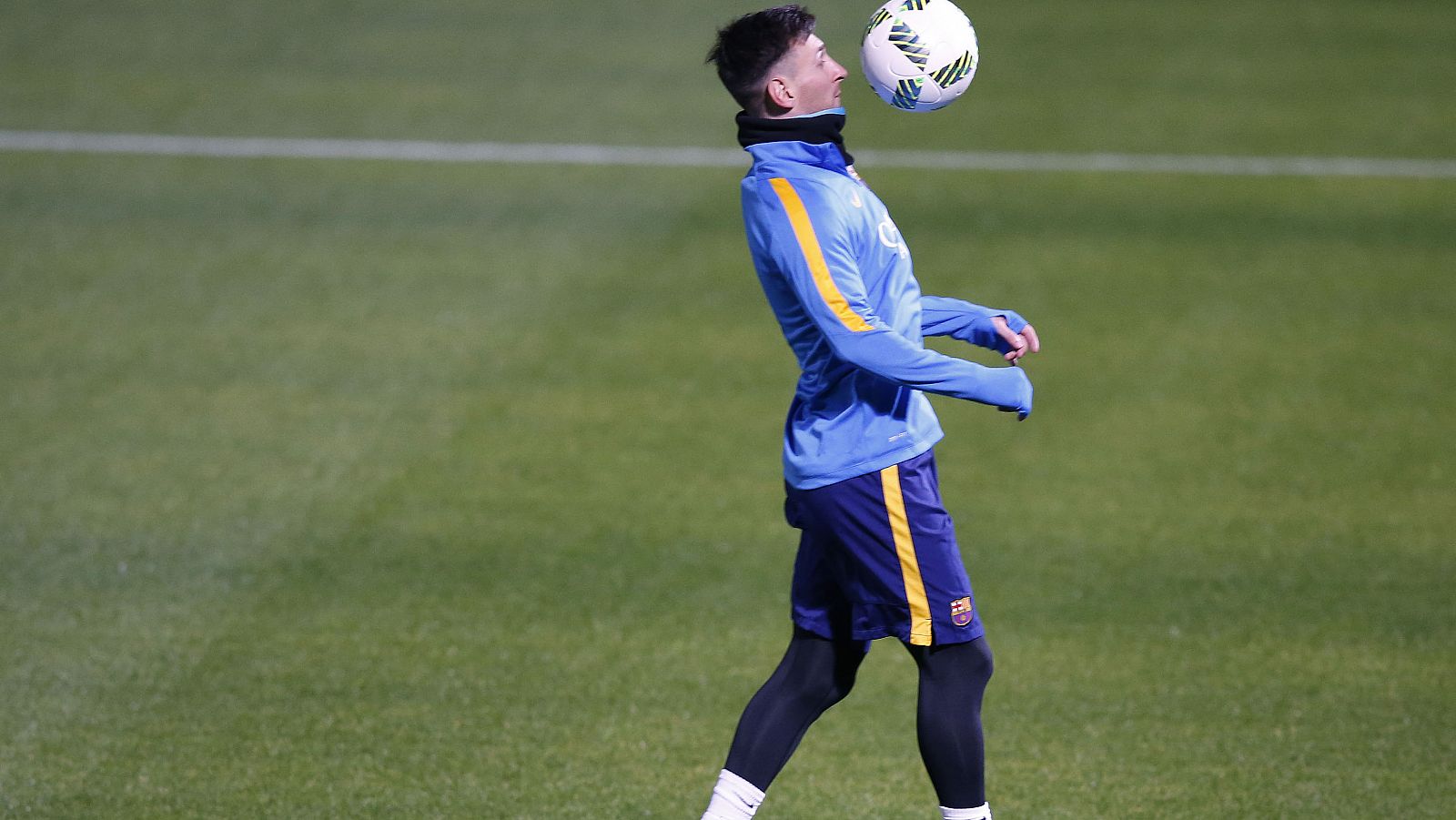 Barcelona's soccer player Messi controls the ball during a training session ahead of their Club World Cup semi-final soccer match against Guangzhou Evergrande in Yokohama