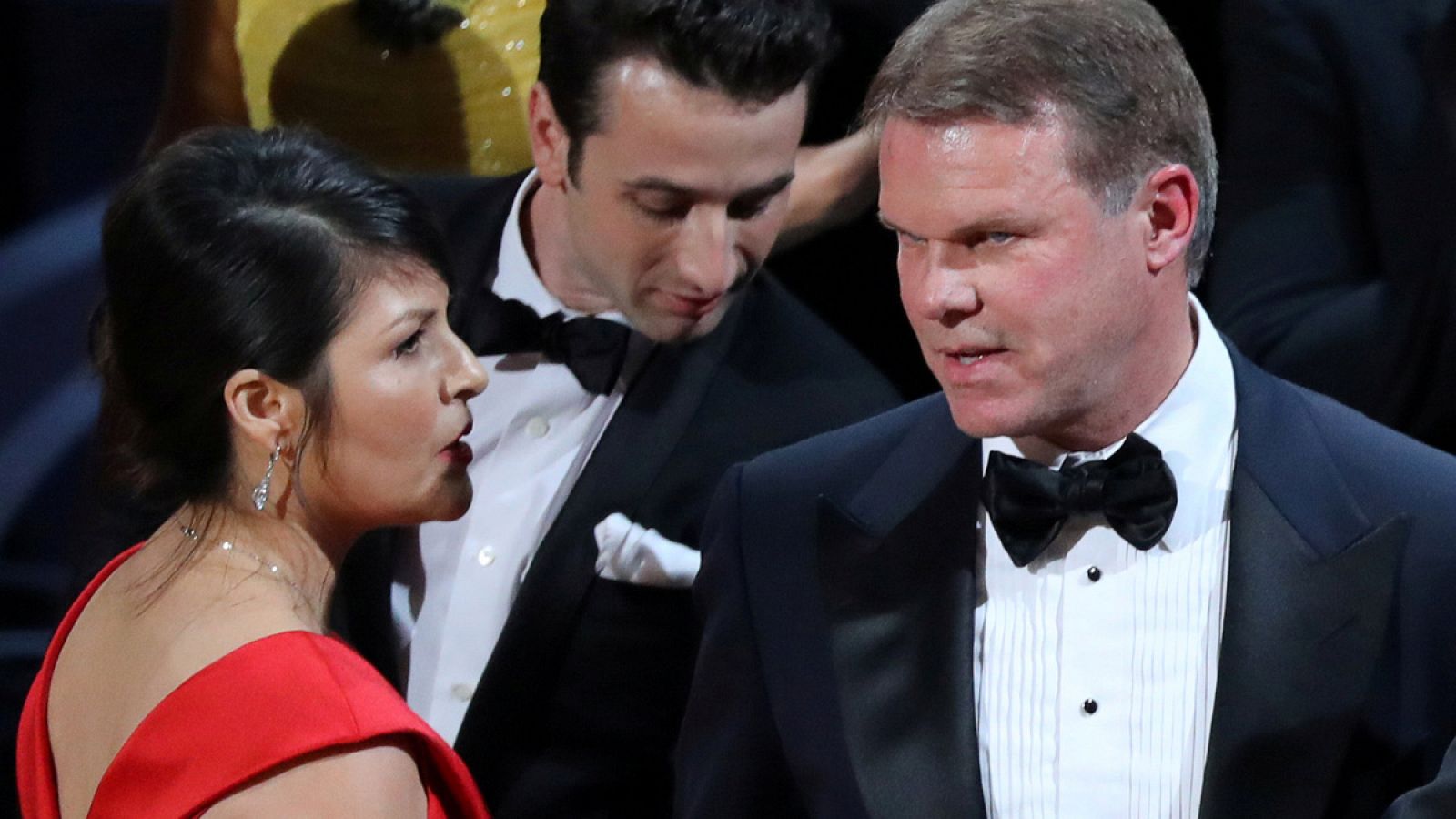 File Photo: Martha Ruiz (L) and Brian Cullinan of PricewaterhouseCoopers confer on stage after the Best Picture was mistakenly awarded to "La La Land" instead of "Moonlight" at the 89th Academy Awards