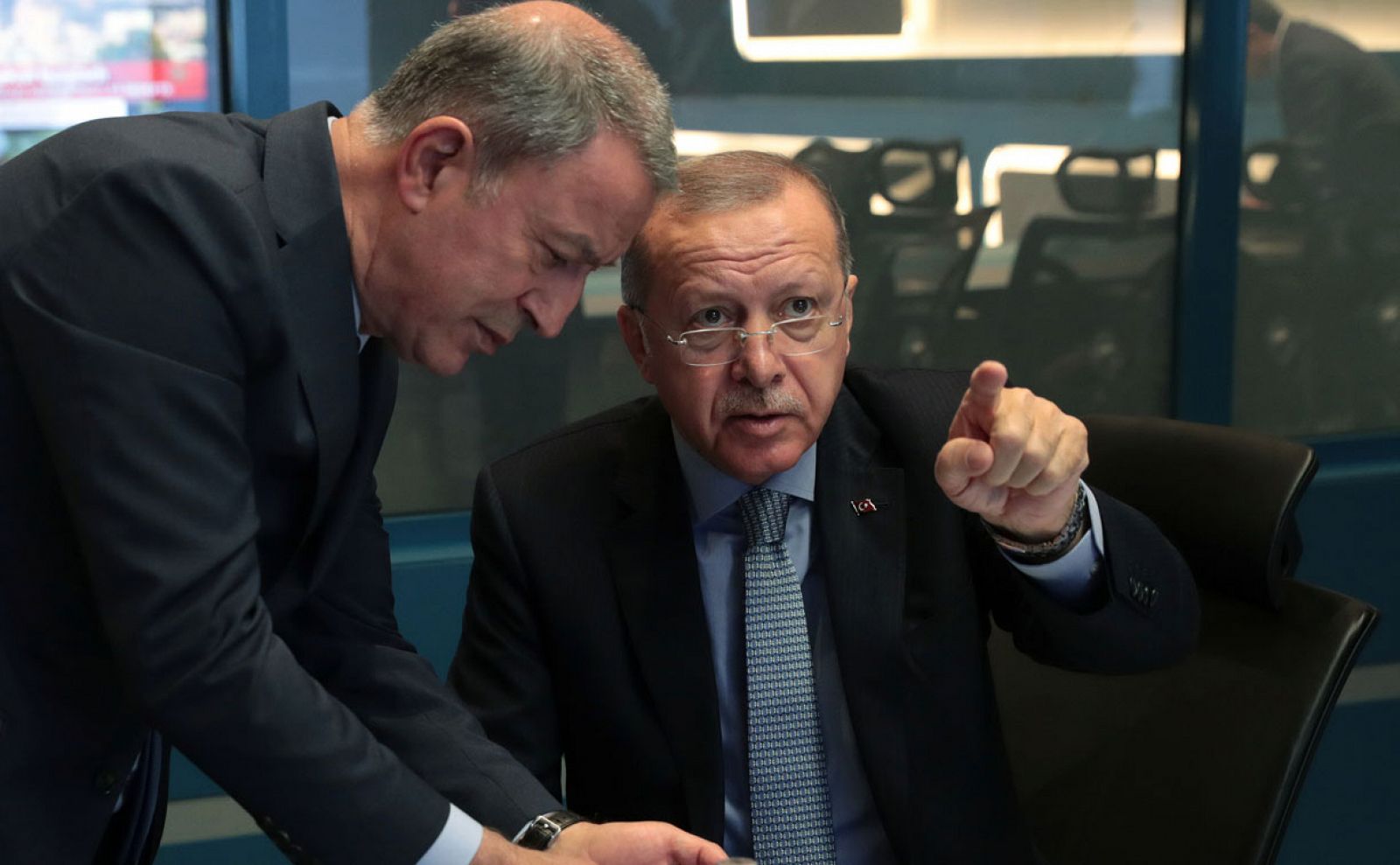 Turkish President Tayyip Erdogan is seen with Defence Minister Hulusi Akar at the operation center in Ankara, Turkey