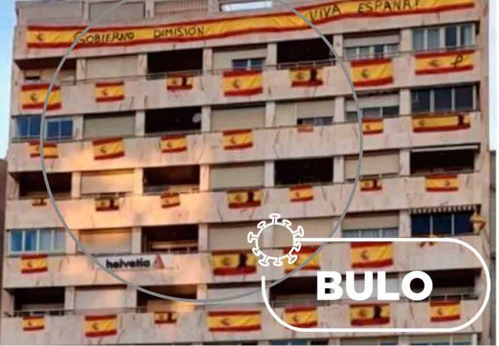 Montaje del edificio con banderas de España en todos sus balcones y sello con la palabra "bulo"