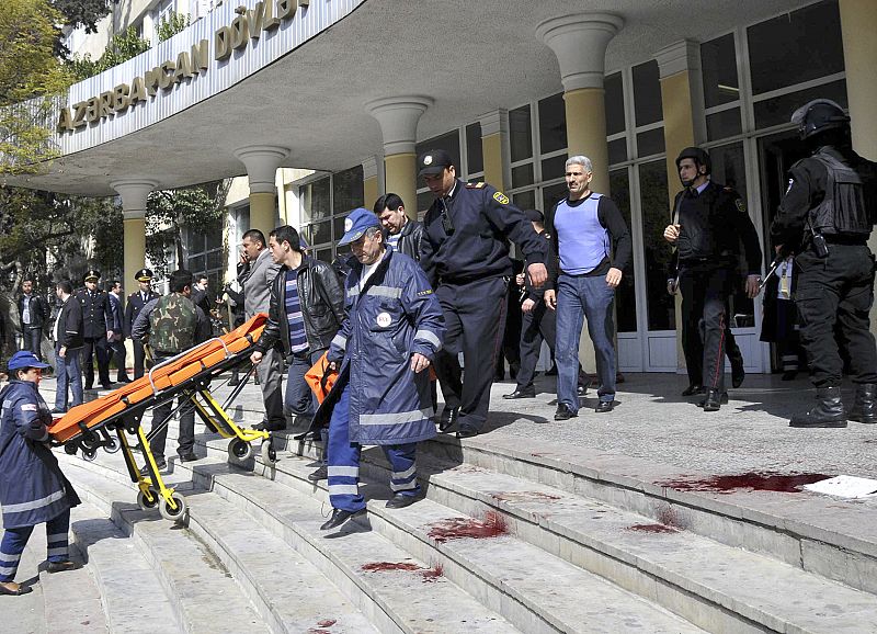 Emergency and Interior Ministry specialists are seen at the main entrance into a university in Baku
