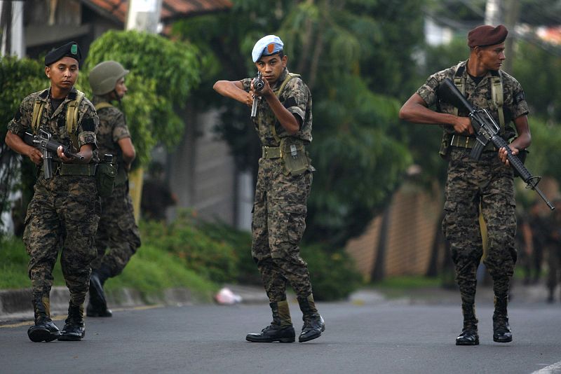 Honduran soldiers block a street near the residence of Honduras' President Manuel Zelaya in Tegucigalpa