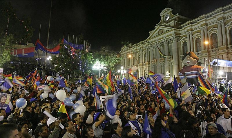Supporters of Bolivia's President Evo Morales celebrate his re-election victory in La Paz