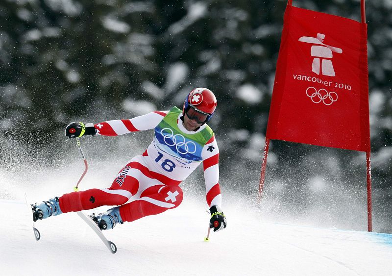 Switzerland's Defago clears a gate during the men's alpine skiing downhill event at the Vancouver 2010 Winter Olympics in Whistler, British Columbia