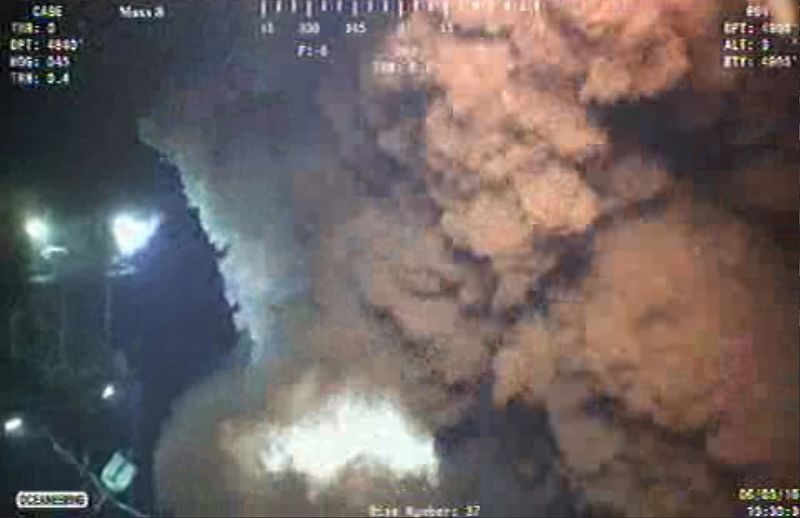 Remotely operated undersea vehicles work to cut and cap the riser pipe at the site of the Deepwater Horizon oil leak as it continues to spew oil into the Gulf of Mexico