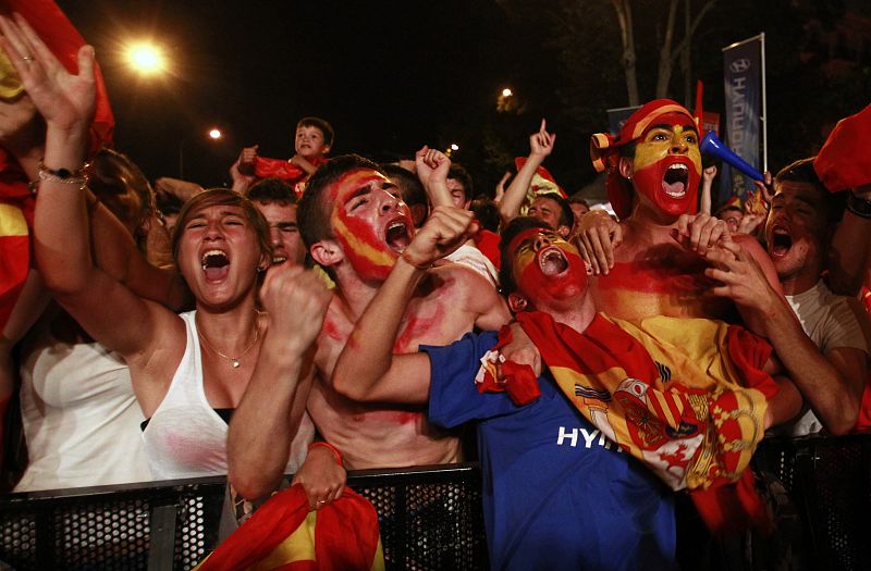 Spain's soccer fans celebrate after their team scored a goal during a public screening of the World Cup 2010 final soccer match in downtown Madrid