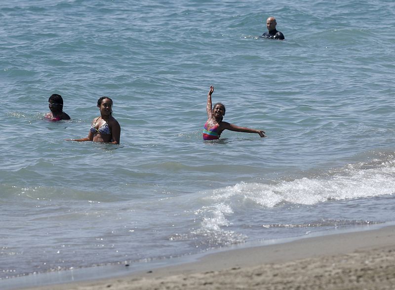 Sasha, daughter of U.S. first lady Michelle Obama, bathes in the Mediterranean Sea in Estepona during their vacation in southern Spain