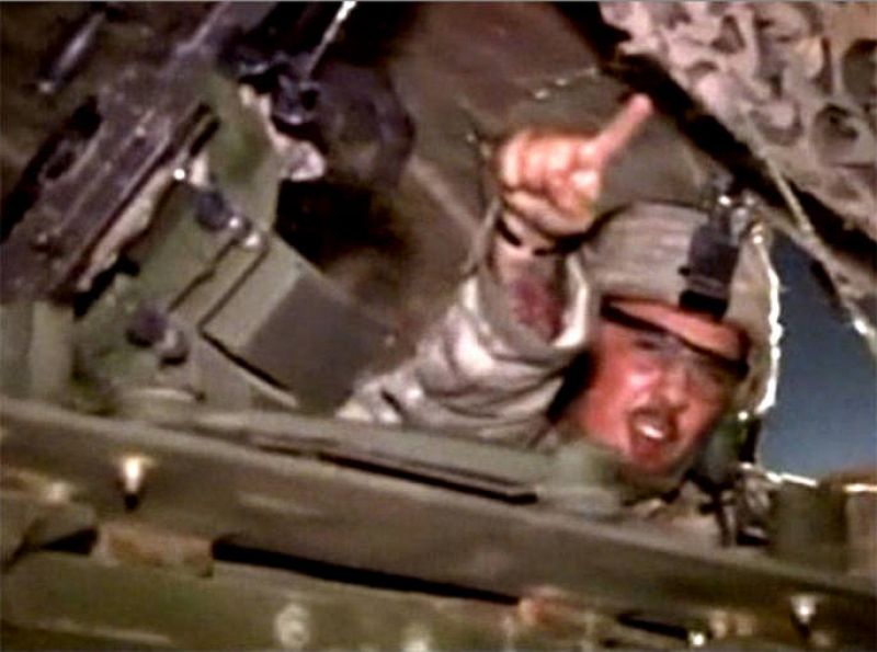 Video frame grab of a U.S. soldier shouting "We're Going Home" as he crosses the Kuwait-Iraq border into Kuwait