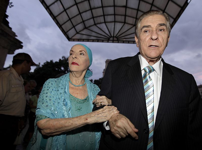 Alicia Alonso, Cuba's prima ballerina assoluta, arrives at Grand Theater of Havana with her husband Pedro Simon during presentation of Royal Ballet in Havana