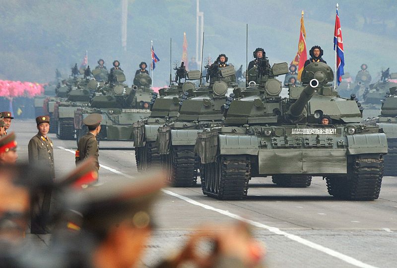 Military personnel participate in a parade to commemorate the 65th anniversary of the founding of the Workers' Party of Korea in Pyongyang