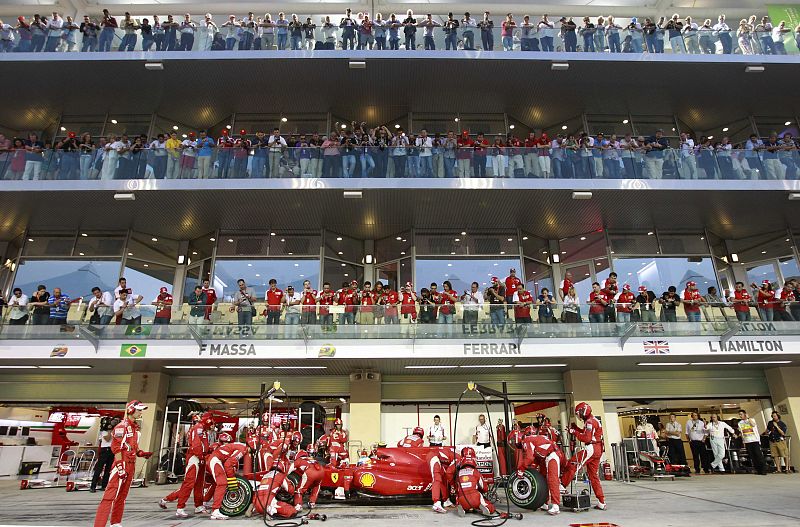Ferrari Formula One driver Fernando Alonso of Spain makes a pit stop during the Abu Dhabi F1 Grand Prix at the Yas Marina circuit in Abu Dhabi