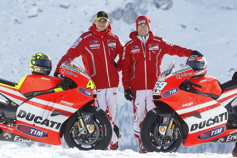 Ducati Moto GP rider Rossi speaks with  teammate Hayden in Madonna di Campiglio