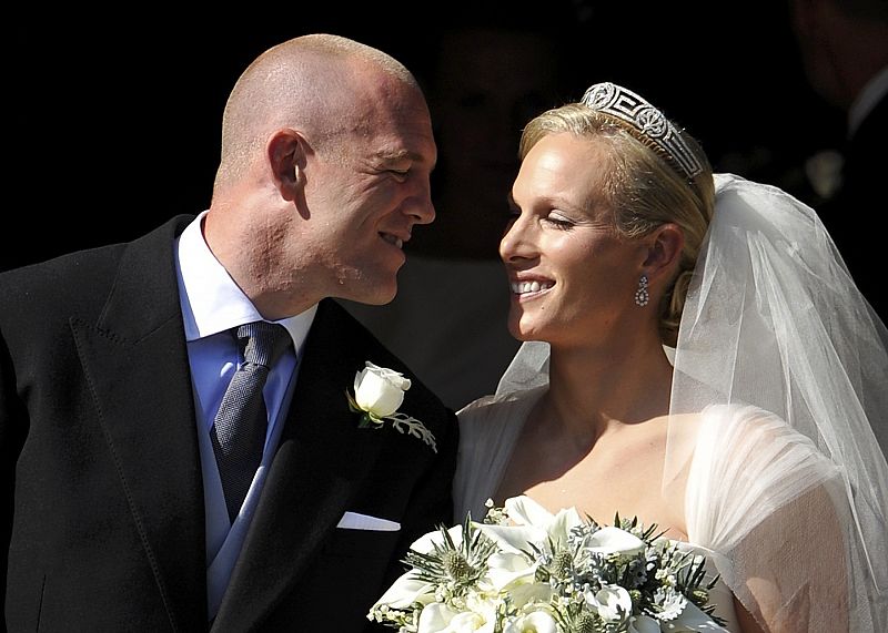 Britain's Zara Phillips and her husband Mike Tindall leave after their marriage at Canongate Kirk in Edinburgh