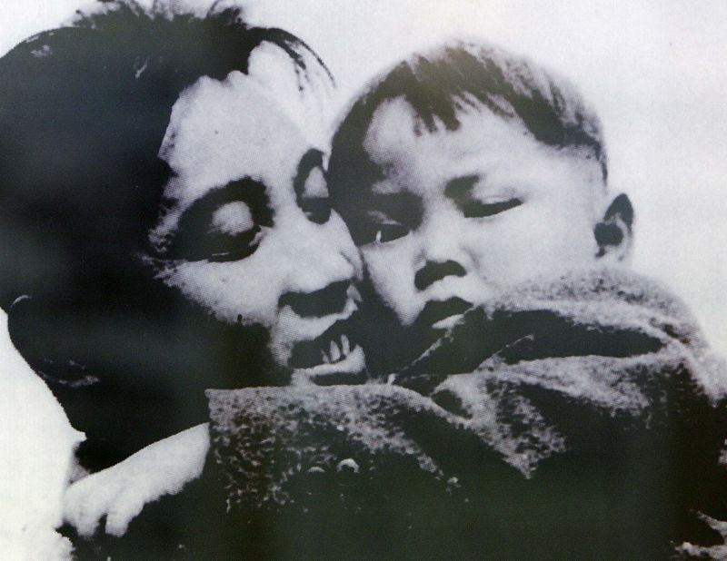 File photo of an image of North Korean leader hugging his son