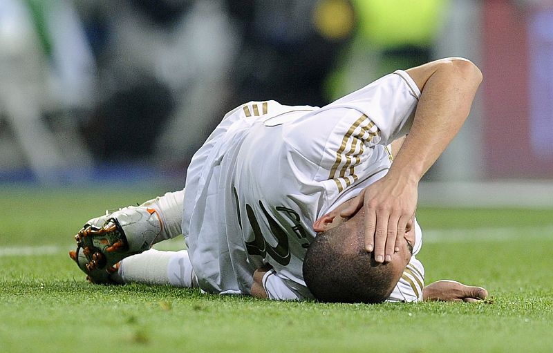 Real Madrid's Pepe gestures after colliding with Barcelona's Cesc Fabregas during their Spanish King's Cup soccer match in Madrid