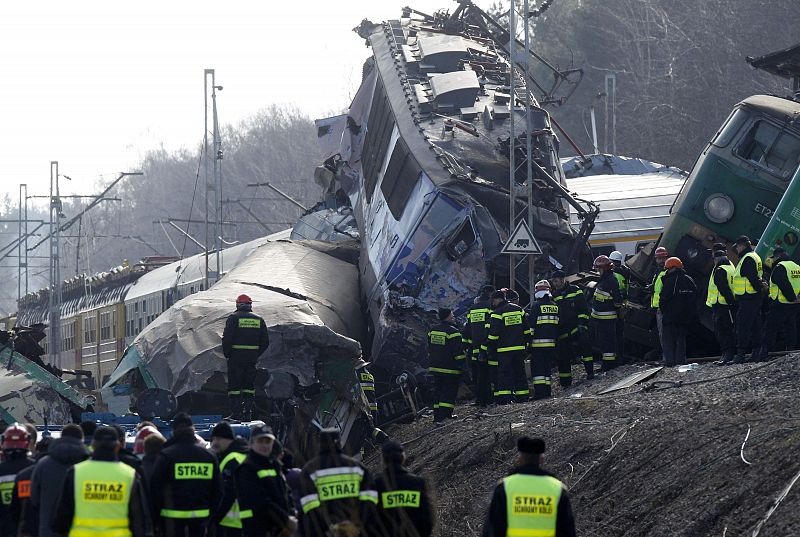 Polish emergency services work at the site of a train crash near the town of Szczekociny