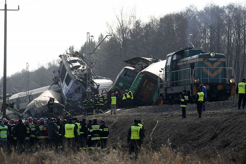 Polish emergency services work at the site of a train crash near the town of Szczekociny