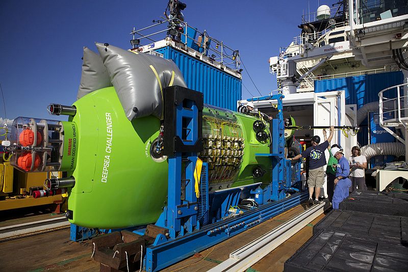 Handout of crews examining the Deepsea Challenger submersible aboard the Mermaid Sapphire off the coast of Australia