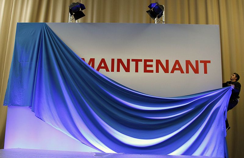 A technician prepares the stage for the speech of Francois Hollande, Socialist Party candidate for the 2012 French presidential election, in Tulle