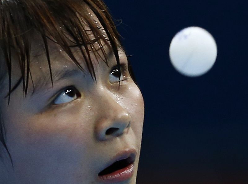 Taiwan's Chen Szu-yu serves to Hungary's Krisztina Toth during their women's singles second round table tennis match in the ExCel venue at the London 2012 Olympic Games