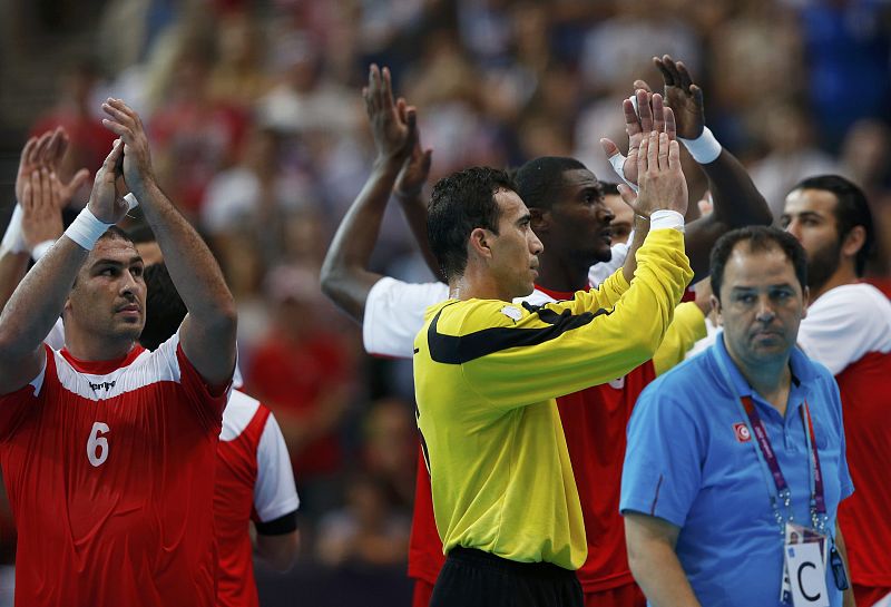 Tunisia celebrates their victory over Britain in their men's handball Preliminaries Group A match at the Copper Box venue during the London 2012 Olympic Games