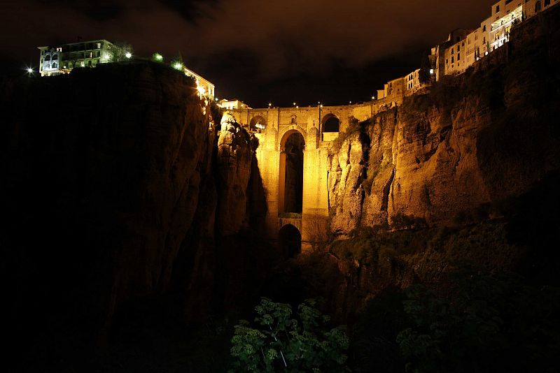 The "Puente Nuevo" (New Bridge) is seen illuminated by artistic lights after Earth Hour in Ronda, near Malaga, southern Spain