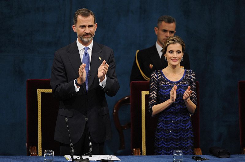 Spain's King Felipe VI and Queen Letizia clap during the ceremony for the Prince of Asturias Awards 2014 in Oviedo